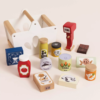 Product information "Groceries Set & Scanner" Spark hours of imaginative play with this beautifully designed wooden grocery playset. It includes a sturdy wooden basket filled with 12 solid wood grocery items and a playful barcode scanner, perfect for pretend shopping adventures. Each item is made from FSC™-certified wood and features charming, colorful illustrations to engage young minds. The set includes familiar favorites like butter, honey, cookies, cereal, ketchup, olive oil, spaghetti, chocolate, tea, a jar of sweet corn and carrots, and a can of tuna. Each piece is perfectly sized for small hands and encourages hands-on learning. Ideal for role play, counting, and building vocabulary, this set helps children develop fine motor skills, early math concepts, and social interaction through creative storytelling and play. A wonderful addition to any toy kitchen or play store setup! Specifications Suitable for ages 3 years+ Dimensions: Shopping Basket – W:19 x D:13.1 x H:15.3cm Made of FSC®-certified wood Decorated using water based, non-toxic paints