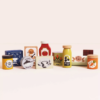 Product information "Groceries Set & Scanner" Spark hours of imaginative play with this beautifully designed wooden grocery playset. It includes a sturdy wooden basket filled with 12 solid wood grocery items and a playful barcode scanner, perfect for pretend shopping adventures. Each item is made from FSC™-certified wood and features charming, colorful illustrations to engage young minds. The set includes familiar favorites like butter, honey, cookies, cereal, ketchup, olive oil, spaghetti, chocolate, tea, a jar of sweet corn and carrots, and a can of tuna. Each piece is perfectly sized for small hands and encourages hands-on learning. Ideal for role play, counting, and building vocabulary, this set helps children develop fine motor skills, early math concepts, and social interaction through creative storytelling and play. A wonderful addition to any toy kitchen or play store setup! Specifications Suitable for ages 3 years+ Dimensions: Shopping Basket – W:19 x D:13.1 x H:15.3cm Made of FSC®-certified wood Decorated using water based, non-toxic paints