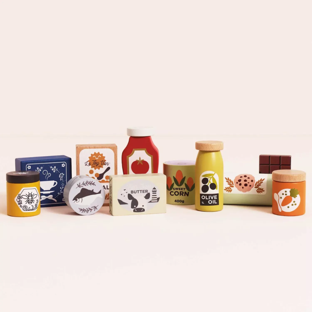 Product information "Groceries Set & Scanner" Spark hours of imaginative play with this beautifully designed wooden grocery playset. It includes a sturdy wooden basket filled with 12 solid wood grocery items and a playful barcode scanner, perfect for pretend shopping adventures. Each item is made from FSC™-certified wood and features charming, colorful illustrations to engage young minds. The set includes familiar favorites like butter, honey, cookies, cereal, ketchup, olive oil, spaghetti, chocolate, tea, a jar of sweet corn and carrots, and a can of tuna. Each piece is perfectly sized for small hands and encourages hands-on learning. Ideal for role play, counting, and building vocabulary, this set helps children develop fine motor skills, early math concepts, and social interaction through creative storytelling and play. A wonderful addition to any toy kitchen or play store setup! Specifications Suitable for ages 3 years+ Dimensions: Shopping Basket – W:19 x D:13.1 x H:15.3cm Made of FSC®-certified wood Decorated using water based, non-toxic paints