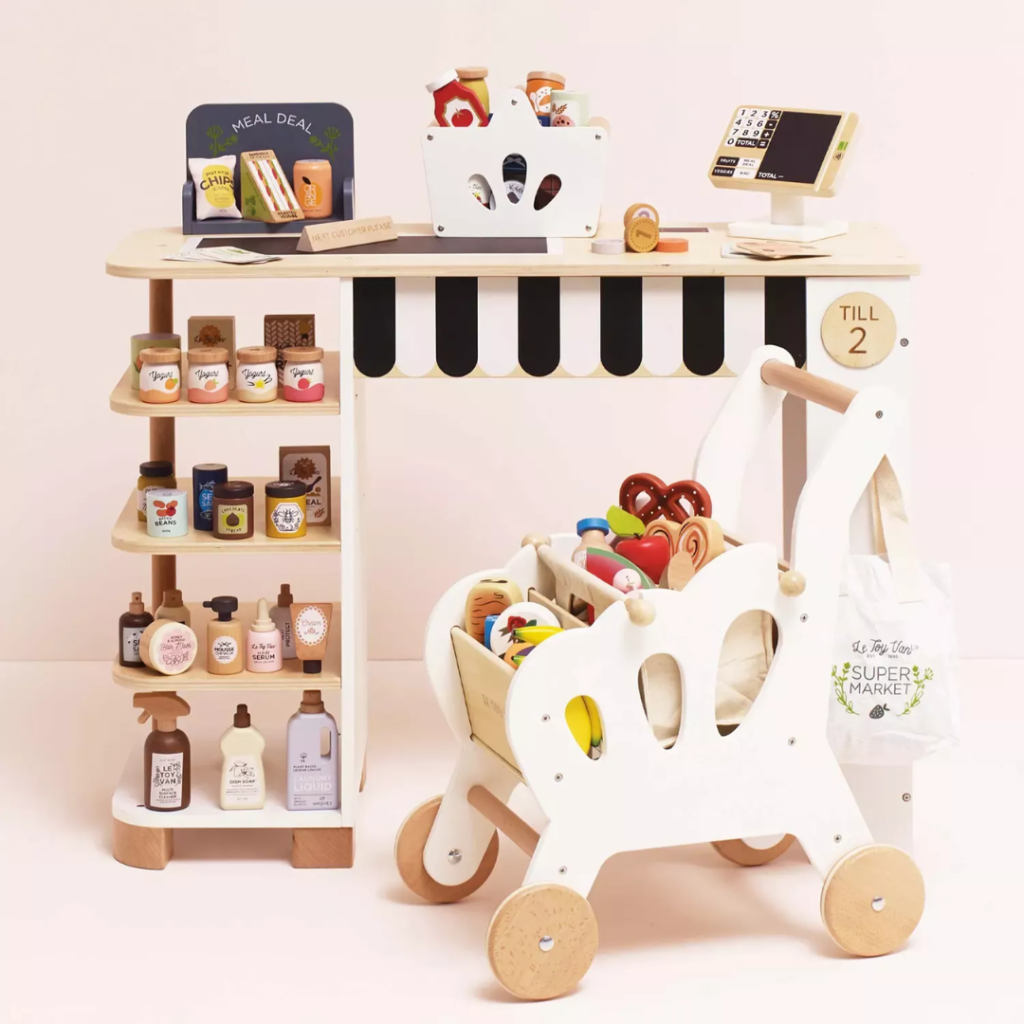 Product information "Groceries Set & Scanner" Spark hours of imaginative play with this beautifully designed wooden grocery playset. It includes a sturdy wooden basket filled with 12 solid wood grocery items and a playful barcode scanner, perfect for pretend shopping adventures. Each item is made from FSC™-certified wood and features charming, colorful illustrations to engage young minds. The set includes familiar favorites like butter, honey, cookies, cereal, ketchup, olive oil, spaghetti, chocolate, tea, a jar of sweet corn and carrots, and a can of tuna. Each piece is perfectly sized for small hands and encourages hands-on learning. Ideal for role play, counting, and building vocabulary, this set helps children develop fine motor skills, early math concepts, and social interaction through creative storytelling and play. A wonderful addition to any toy kitchen or play store setup! Specifications Suitable for ages 3 years+ Dimensions: Shopping Basket – W:19 x D:13.1 x H:15.3cm Made of FSC®-certified wood Decorated using water based, non-toxic paints