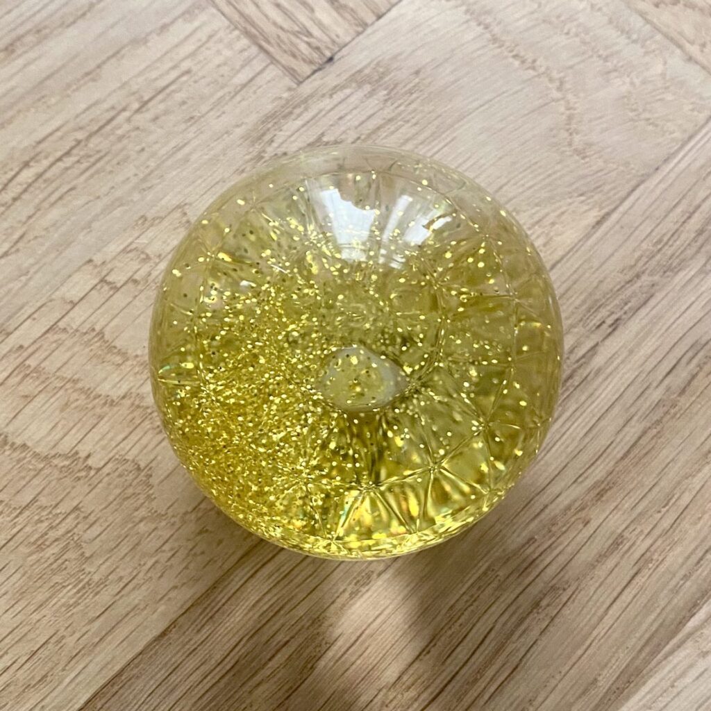 Sensorisk glitter bolde 1 stk. - TickiT - Gul