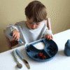 a child eating berries from a blue plate. cam cam Hagesmæk med Ærmer - Classic Stripes Blue