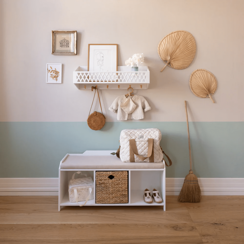 a room with a bench and shelves and objects on the wall. cam cam Harlequin Hylde med knager, FSC Mix - Hvid