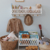 a shelf with toys and a hat on it. cam cam Harlequin Hylde med knager, FSC Mix - Hvid