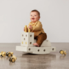 MODU curiosity set sandfarvet. smilende barn der vipper